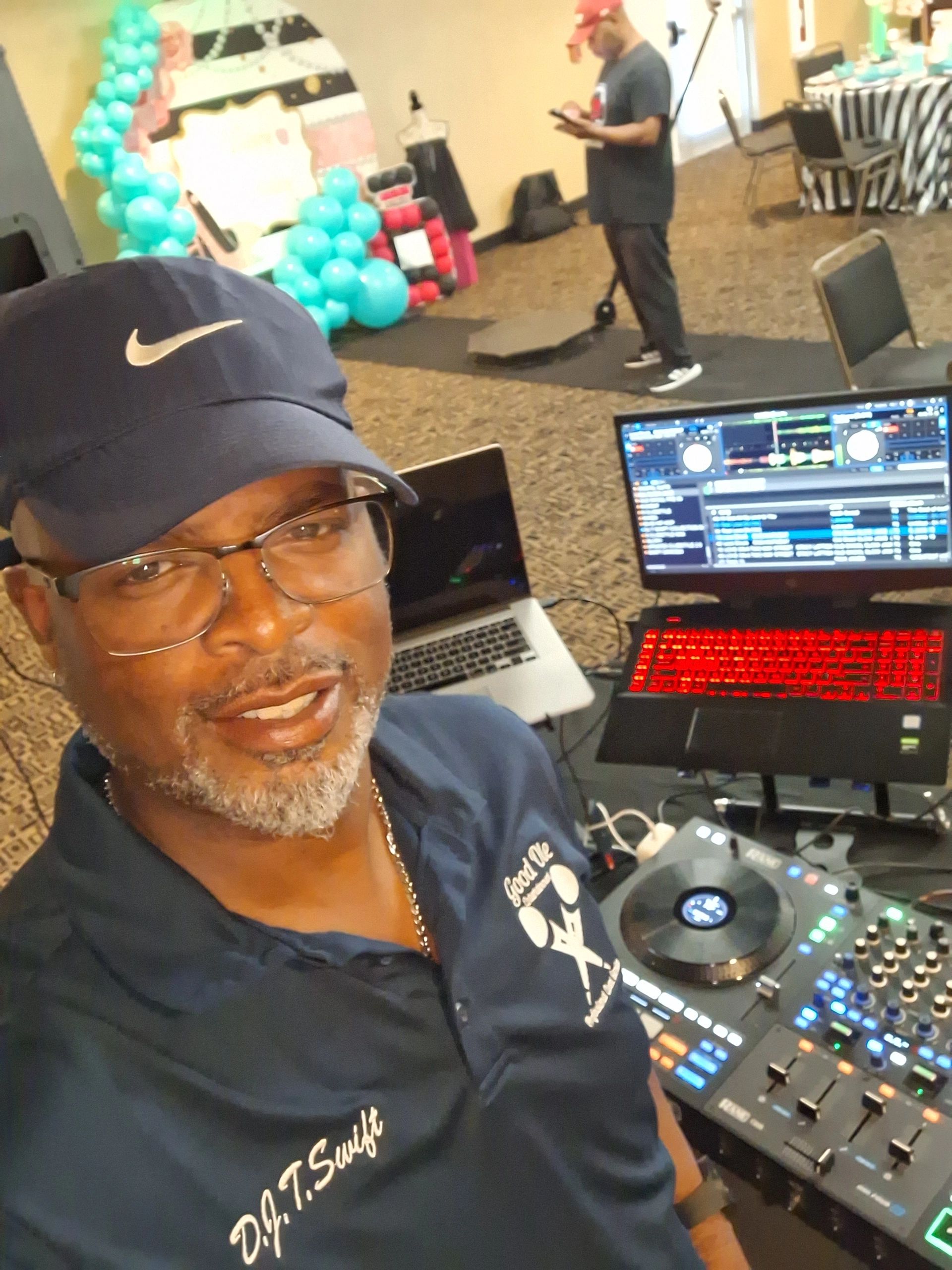 DJ operating turntable at event